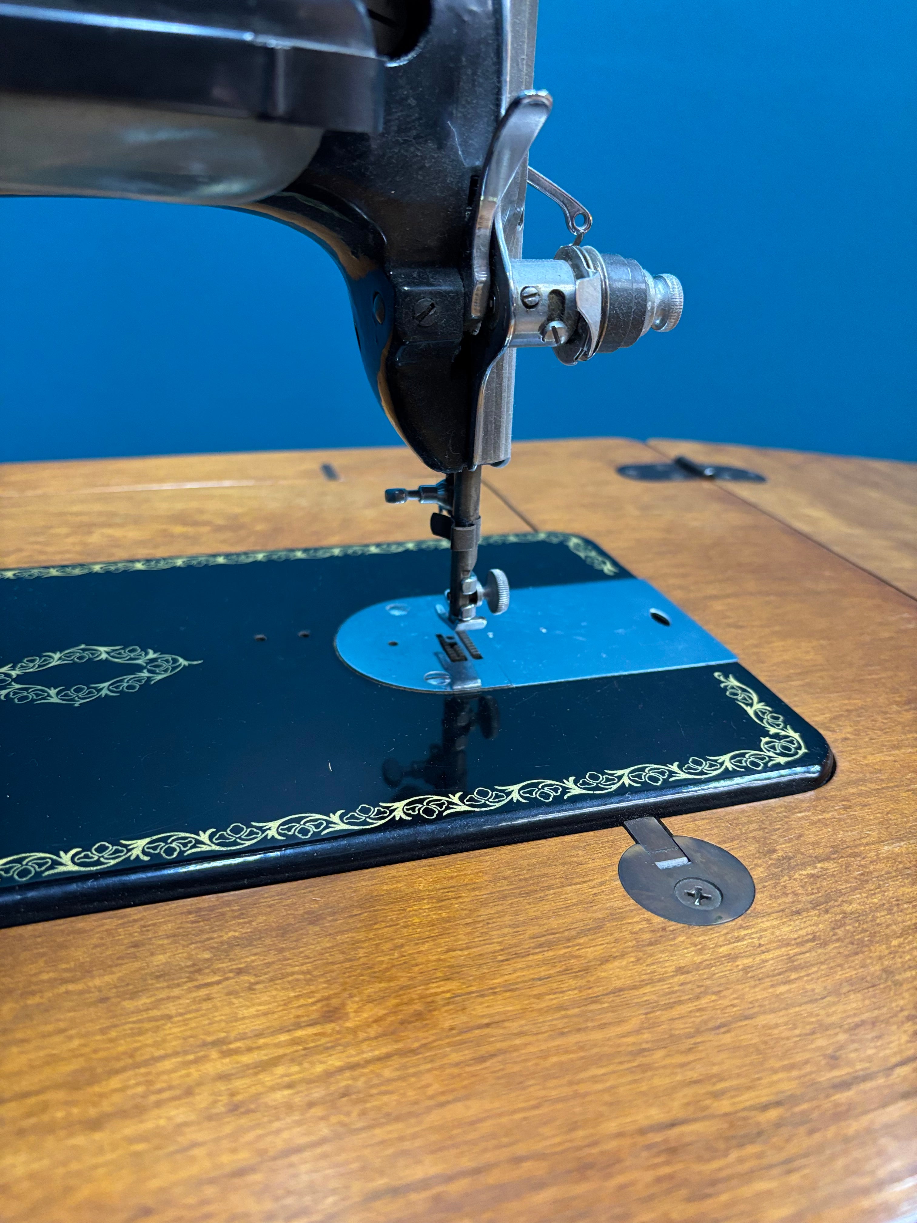 Singer Sewing Machine & Cabinet