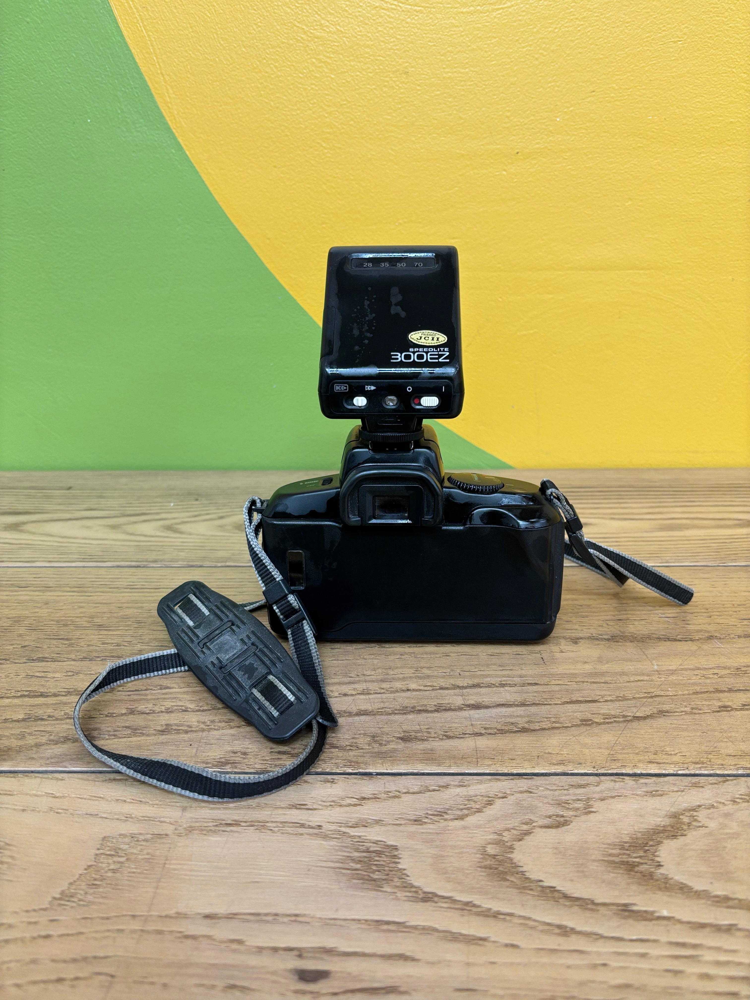 Canon EOS 750 Film Camera with Speedlite 300EZ Attached Flash